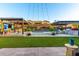Expansive backyard with outdoor kitchens, pool, and lush landscaping offer a private outdoor living experience at 2335 E Allen St, Phoenix, AZ 85042