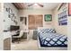 Stylish bedroom with blue patterned bedding features a workspace and unique ceiling fan at 2335 E Allen St, Phoenix, AZ 85042