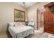 Charming bedroom with shuttered window and quaint vanity area offers a serene retreat at 2335 E Allen St, Phoenix, AZ 85042