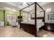 Spacious bedroom featuring a four-poster bed, fireplace and sitting area, providing a luxurious retreat at 2335 E Allen St, Phoenix, AZ 85042