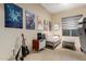 Cozy bedroom space featuring unique wall art, comfortable seating, and soft lighting for a relaxing atmosphere at 2335 E Allen St, Phoenix, AZ 85042