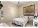 Cozy bedroom features a white metal bed frame, wood shutters, and playful décor at 2335 E Allen St, Phoenix, AZ 85042