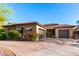 Charming single-story home with desert landscaping, a two-car garage, and a circular driveway at 2335 E Allen St, Phoenix, AZ 85042