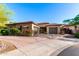 Charming single-story home with a tile roof, desert landscaping and circular driveway at 2335 E Allen St, Phoenix, AZ 85042