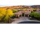 Aerial view of home showing a three-car garage and beautiful mountain views at 2335 E Allen St, Phoenix, AZ 85042