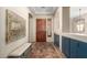 Spacious foyer with tile flooring, custom storage and entry to main living areas at 2335 E Allen St, Phoenix, AZ 85042