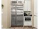 Modern kitchen featuring stainless steel refrigerator and appliances with white cabinetry at 2335 E Allen St, Phoenix, AZ 85042
