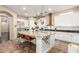 Spacious kitchen featuring a large island with seating, white cabinetry, and stainless steel appliances at 2335 E Allen St, Phoenix, AZ 85042