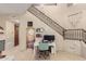 Living area with desk, stairs, and decorative macrame offers a modern and stylish space at 2335 E Allen St, Phoenix, AZ 85042