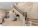 Open living area with desk, stairs, and bar area, creating a versatile and inviting space at 2335 E Allen St, Phoenix, AZ 85042