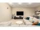 Inviting living room features a comfortable couch, entertainment center, and a cozy bar area for relaxation at 2335 E Allen St, Phoenix, AZ 85042