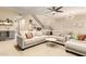 A modern living room with a large sectional sofa, a bar area, and stylish decor, perfect for entertaining at 2335 E Allen St, Phoenix, AZ 85042