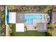 Aerial view of a backyard oasis with a sparkling pool, covered patios, and desert landscaping at 2335 E Allen St, Phoenix, AZ 85042