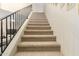 Carpeted staircase provides a safe and elegant transition between levels, adding a touch of comfort at 2335 E Allen St, Phoenix, AZ 85042