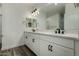 Bright bathroom featuring double vanity with modern fixtures and neutral color palette at 2511 W Queen Creek Rd # 266, Chandler, AZ 85248