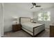 Inviting bedroom with neutral décor, ceiling fan, and window with bright light at 2511 W Queen Creek Rd # 266, Chandler, AZ 85248