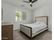 Cozy bedroom featuring a ceiling fan, neutral walls, and bright natural light at 2511 W Queen Creek Rd # 266, Chandler, AZ 85248