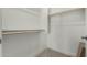 A closet with carpeted floors, white walls, and two wooden clothing rods at 2511 W Queen Creek Rd # 266, Chandler, AZ 85248