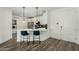 Modern kitchen with white cabinets, stainless appliances, and a breakfast bar with seating at 2511 W Queen Creek Rd # 266, Chandler, AZ 85248