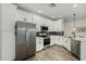 Modern kitchen with stainless steel appliances, white cabinets, and modern tile backsplash at 2511 W Queen Creek Rd # 266, Chandler, AZ 85248
