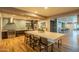Beautiful kitchen with a large central island, modern appliances, and stylish backsplash, and table at 2511 W Queen Creek Rd # 266, Chandler, AZ 85248