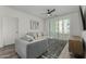 Bright living room boasts neutral tones, modern ceiling fan, plush seating, and access to a balcony at 2511 W Queen Creek Rd # 266, Chandler, AZ 85248