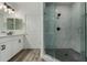 Modern glass shower with stylish marble tiling and black honeycomb floor at 2511 W Queen Creek Rd # 266, Chandler, AZ 85248