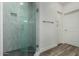 Modern glass shower with stylish marble tiling and black honeycomb floor at 2511 W Queen Creek Rd # 266, Chandler, AZ 85248