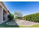 Landscaped backyard with decorative rock, bushes and artificial turf creating a serene and inviting outdoor space at 26168 W Tina Ln, Buckeye, AZ 85396