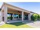 Beautiful backyard featuring a covered patio and artificial turf, perfect for outdoor enjoyment and low maintenance at 26168 W Tina Ln, Buckeye, AZ 85396
