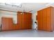 Garage offering plenty of storage space with built-in cabinetry and epoxy flooring at 26168 W Tina Ln, Buckeye, AZ 85396