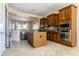 Open kitchen design with an island, stainless steel appliances, and ample cabinet space at 26168 W Tina Ln, Buckeye, AZ 85396