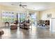 Inviting living room with large windows, stylish furniture, and a comfortable layout perfect for relaxation at 26168 W Tina Ln, Buckeye, AZ 85396