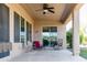 Covered patio area furnished with chairs, ideal for outdoor relaxation and entertaining at 26168 W Tina Ln, Buckeye, AZ 85396