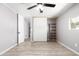 Spacious bedroom features a ceiling fan, closet, and light-colored wood-look flooring at 2650 W Union Hills Dr # 131, Phoenix, AZ 85027