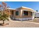 Charming home with a well-manicured lawn, complemented by a unique tree and convenient step access at 2650 W Union Hills Dr # 131, Phoenix, AZ 85027