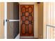 Close-up of the front door highlighting its stylish design and secure screen door at 2650 W Union Hills Dr # 131, Phoenix, AZ 85027