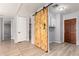 Hallway with laundry area and sliding barn door at 2650 W Union Hills Dr # 131, Phoenix, AZ 85027