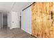 Hallway with a decorative sliding barn door accent at 2650 W Union Hills Dr # 131, Phoenix, AZ 85027