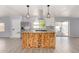 Bright kitchen featuring a unique wooden island and stainless steel appliances at 2650 W Union Hills Dr # 131, Phoenix, AZ 85027