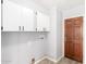 Laundry room features updated cabinets and a wood door at 2650 W Union Hills Dr # 131, Phoenix, AZ 85027