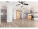 Spacious living room featuring a rustic sliding door and modern flooring at 2650 W Union Hills Dr # 131, Phoenix, AZ 85027