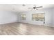 Open living room with modern flooring, bright windows, and ceiling fan for a comfortable living space at 2650 W Union Hills Dr # 131, Phoenix, AZ 85027