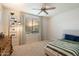 Sunlit bedroom with a ceiling fan, neutral colors, and a cozy atmosphere at 27203 N 78Th Ln, Peoria, AZ 85383