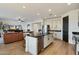 Well-lit kitchen with an island that includes counter seating, stainless steel appliances, and modern finishes at 27203 N 78Th Ln, Peoria, AZ 85383