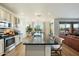 Modern kitchen featuring a large island, stainless steel appliances, and an open floor plan at 27203 N 78Th Ln, Peoria, AZ 85383