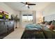 This main bedroom offers great natural light, an accent wall, stylish furniture, and a ceiling fan at 27203 N 78Th Ln, Peoria, AZ 85383