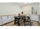 Well-lit home office with built-in cabinets, a work desk, and a comfortable chair at 27203 N 78Th Ln, Peoria, AZ 85383