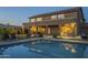Gorgeous backyard pool with a covered patio featuring an outdoor kitchen and comfortable seating area at 27316 N Covered Wagon Rd, Phoenix, AZ 85085