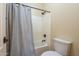 Bathroom featuring a shower with curtain, a toilet and tiled walls at 27316 N Covered Wagon Rd, Phoenix, AZ 85085